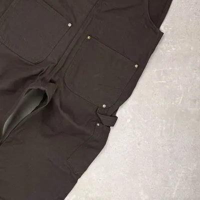 Salopette marron à plat : poche arrière, poche latérale et boucle porte-marteau